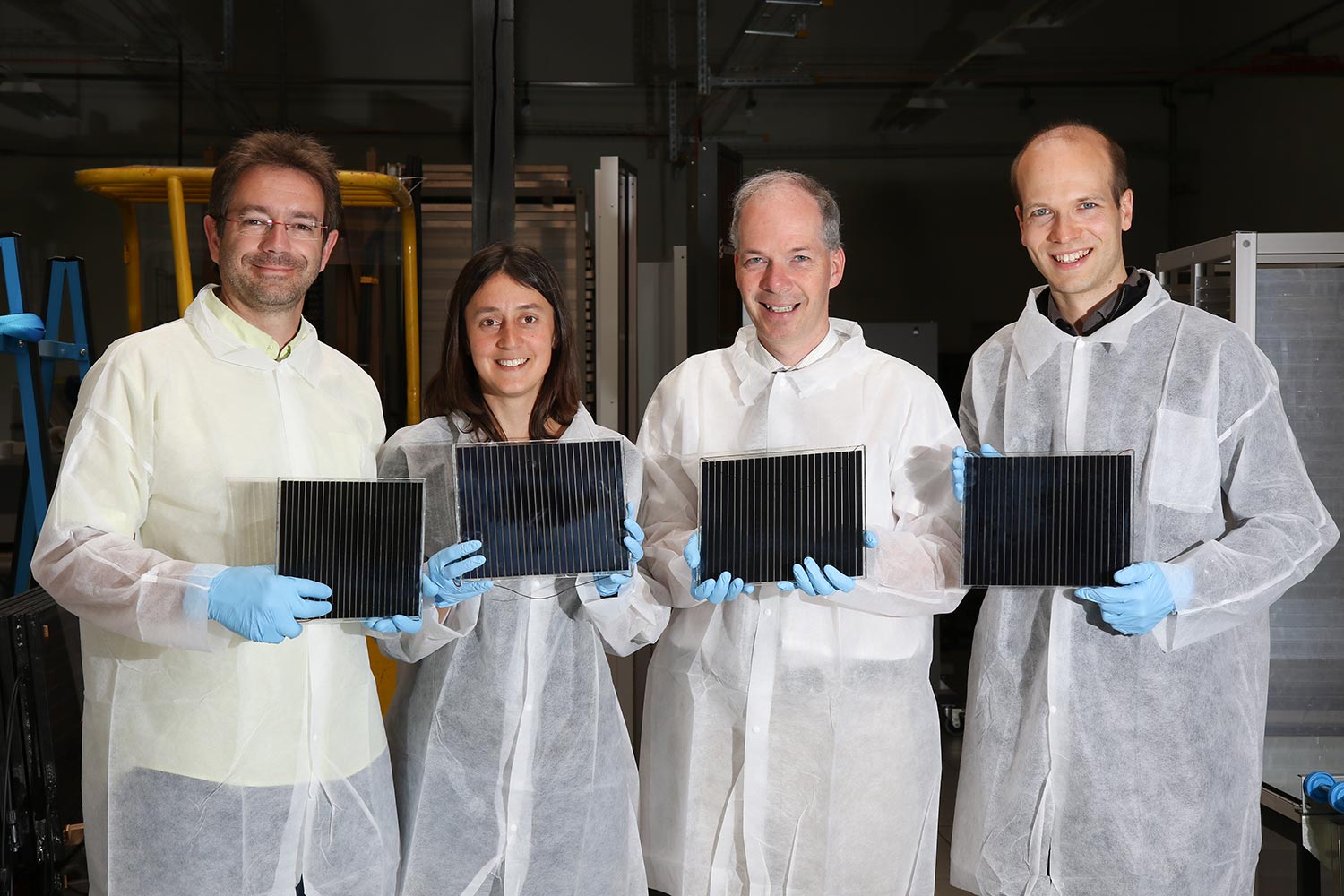 R&D Team at Solaronix holding Perovskite Solar Modules out of their prototype factory.